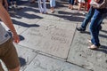 handprints of stars in Hollywood in the concrete of Chinese Theatre\'s forecourts.