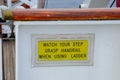 Handrail Caution sign on cruise ship Royalty Free Stock Photo
