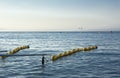 Handrails on beach for disabled people with ship at bottom in th