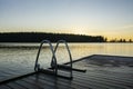 Handrails on the wooden swimming pier and The Lake Saimaa on the background, Ukonlinna beach, Imatra, Finland