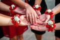 Hands Adorned with Elegant Floral Corsages in a Festive Gathering Royalty Free Stock Photo