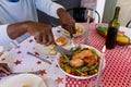 Hands of african american senior man eating christms meal at home Royalty Free Stock Photo