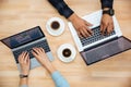 Hands of african man and caucasian woman typing on laptops Royalty Free Stock Photo