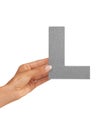 Hands, alphabet and capital letter L in studio isolated on a white background mockup space. Fingers, font and closeup of