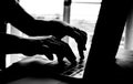 hands of anonymous hackers typing code on keyboard of laptop for