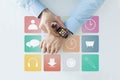 Hands with application icons on smart watch Royalty Free Stock Photo