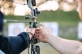 Hands, archery coach and bow or arrow learning for archer competition, athlete focus challenge or girl training practice Royalty Free Stock Photo