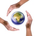 Hands around spinning earth globe Royalty Free Stock Photo