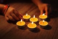 Hands arranging Tea lights candles Royalty Free Stock Photo