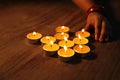 Hands arranging Tea lights candles Royalty Free Stock Photo