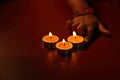 Hands arranging Tea lights candles Royalty Free Stock Photo