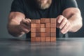 Hands arranging wooden blocks for business growth success development concept with copy space Royalty Free Stock Photo