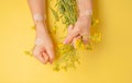 Hands art flower natural cosmetics women, yellow beautiful, spring flowers hand with bright contrast makeup, hand care. Fashion,