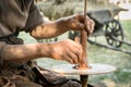 Hands of a artisan creating new clay shape from brown clay