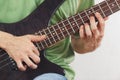 Hands of artist playing the electric bass guitar close up Royalty Free Stock Photo