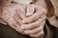 Hands Asian elderly woman grasps her hand on lap, pair of elderly wrinkled hands in prayer and Traces of hard work, World Kindness