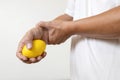 Hands of asian male holding a stress ball,man patient doing hand and wrist exercise,training with rubber ball,squeezing for muscle Royalty Free Stock Photo