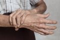 Hands of Asian elder man. Concept of joint pain, arthritis or hand problems Royalty Free Stock Photo