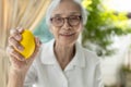 Hands of asian senior woman holding a stress ball,old elderly patient doing hand and wrist exercise,training with rubber ball, Royalty Free Stock Photo