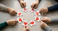 Hands assembling heart shaped puzzle pieces in a circle Royalty Free Stock Photo