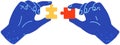 Hands assembling jigsaw puzzle pieces together. Multicolored logic toy, folding picture or mosaic