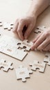 Hands assembling wooden puzzle pieces labeled wellness and mind Royalty Free Stock Photo