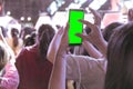 Hands of audience crowd people taking photo with mobile smart phone with green screen in party concert Royalty Free Stock Photo