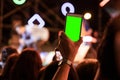 Hands of audience crowd people taking photo with mobile smart phone with green screen in party concert Royalty Free Stock Photo