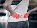 Hands, back pain and overlay with a sports woman holding her muscle while suffering from cramp or injury. Fitness