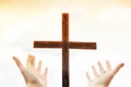 Hands on the background of the cross. Hands praise God. Blank cross against the sky. Real Easter. Hope in God Royalty Free Stock Photo