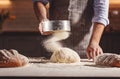 Hands of baker`s male knead dough Royalty Free Stock Photo