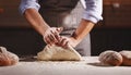 Hands of baker`s male knead dough Royalty Free Stock Photo