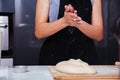 Hands of baker woman female making clapping flour dough Royalty Free Stock Photo
