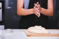 Hands of baker woman female making sprinkling flour dough Royalty Free Stock Photo