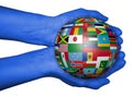 Hands with ball with flags , map of the world drawn Royalty Free Stock Photo