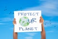 Hands with banner protect ur planet