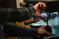 Hands of a barista cleaning the coffee machine