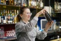 The hands of a bartender woman hold a professional shaker Royalty Free Stock Photo