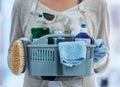 Hands, basket and product for cleaning home with brush, cloth or chemical for hygiene by blurred background. House