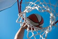 Hands and basketball. Scoring the winning points at a basketball game. Basketball as a sports and fitness symbol of a Royalty Free Stock Photo