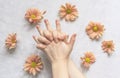 Hands of a beautiful woman on a white background. Delicate palm with natural manicure, clean skin. Light white nails. Hand Care Royalty Free Stock Photo