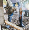 Hands, beekeeping and smoker at bee farm for smoking bees. Safety, beekeeper and worker, employee or person in suit with