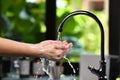 Hands being washed scrubbed and rinsed using disinfectant soap for hygiene and protection against CORONAVIRUS COVID-19 and othe