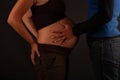 Hands and Belly - Pregnant woman belly holding hands of mother, father and child Royalty Free Stock Photo