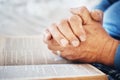 Hands, Bible and pray with God and worship, religion with faith or spiritual, reading scripture for guide and hope Royalty Free Stock Photo