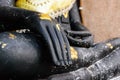 Hands of black Buddha statue Royalty Free Stock Photo