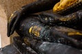 Hands of black Buddha statue Royalty Free Stock Photo