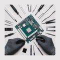 Hands in black gloves assembling computer motherboard with tools circuit technology Royalty Free Stock Photo