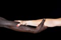 A hands of black man and white woman on black Royalty Free Stock Photo
