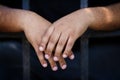 Hands of black prisoner in camera Royalty Free Stock Photo